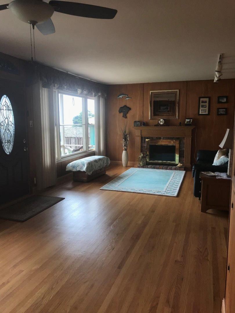 661 Brighton Road Pacifica, CA 94044 - Photo 4 of 18 a living room with furniture and a wooden floor