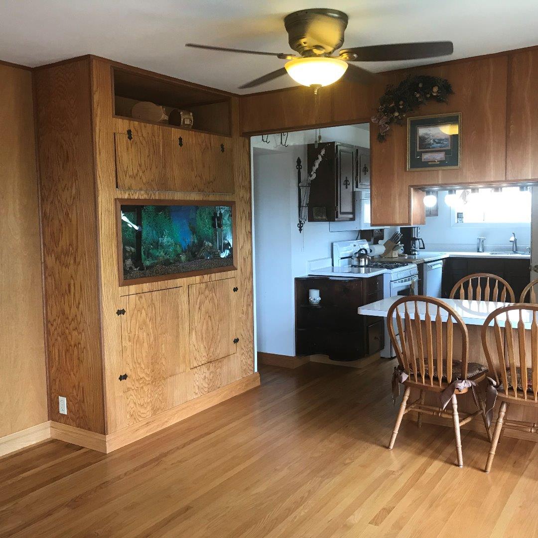 661 Brighton Road Pacifica, CA 94044 - Photo 7 of 18 a kitchen with stainless steel appliances granite countertop a microwave a stove and white cabinets
