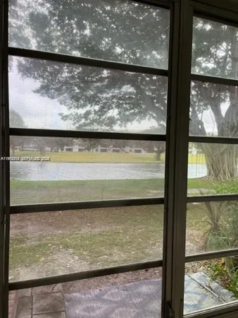 a view of a glass door with a outdoor from a window