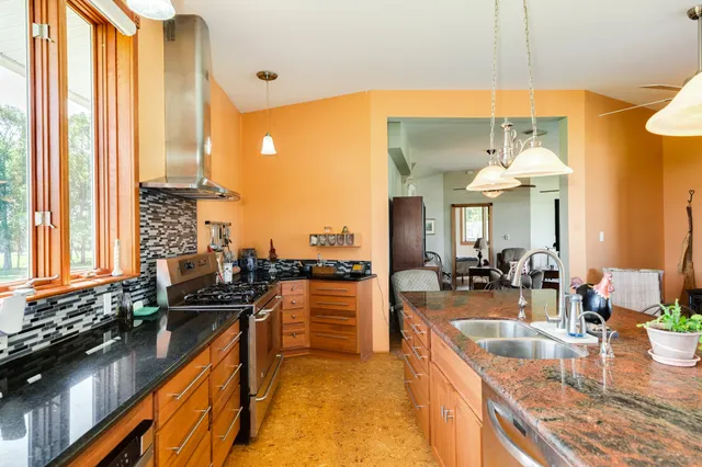 a dining table with chairs and a chandelier
