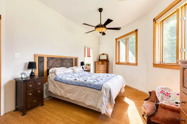 a bathroom with a granite countertop sink mirror and shower
