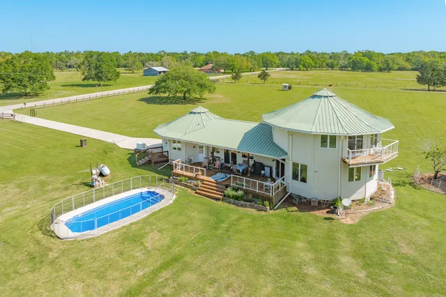 a view of a swimming pool with lounge chairs