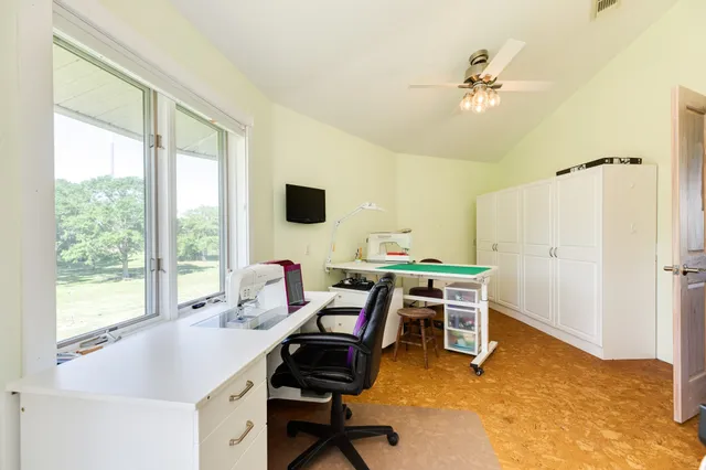 a view of balcony with wooden floor and fence