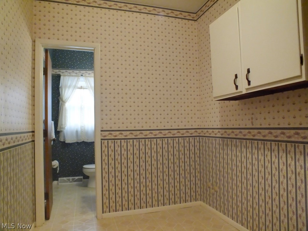 1022 Millridge Road Cleveland, OH 44143 - Photo 14 of 23 Off the Family Room is a nice size Mud Room which is plumbed for a first floor Laundry if desired...beyond is a nice Powder Room. To the left is the entrance out to the two-car Garage.