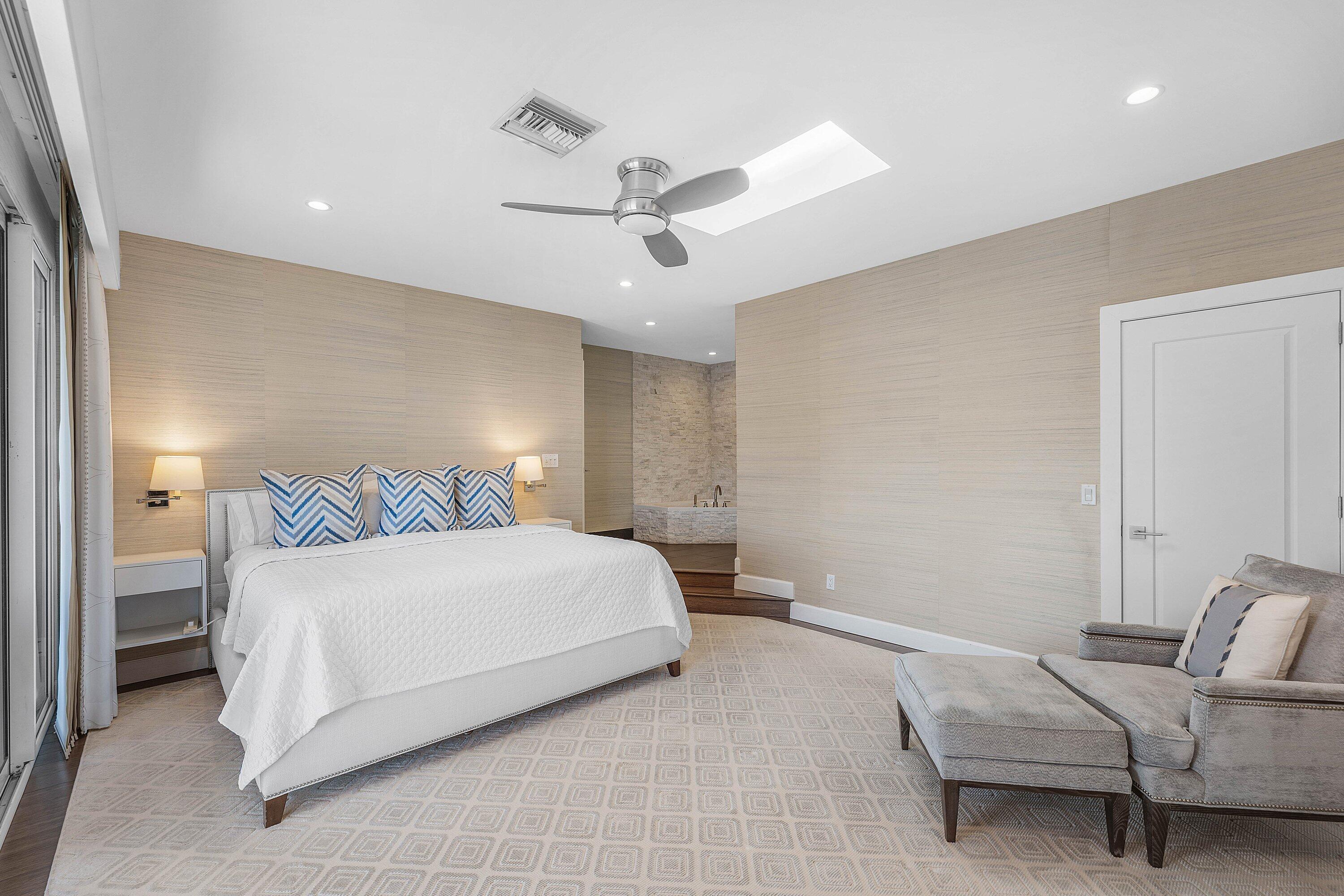 811 Palm Trail Delray Beach, FL 33483 - Photo 14 of 57 a bedroom with a bed and ceiling fan