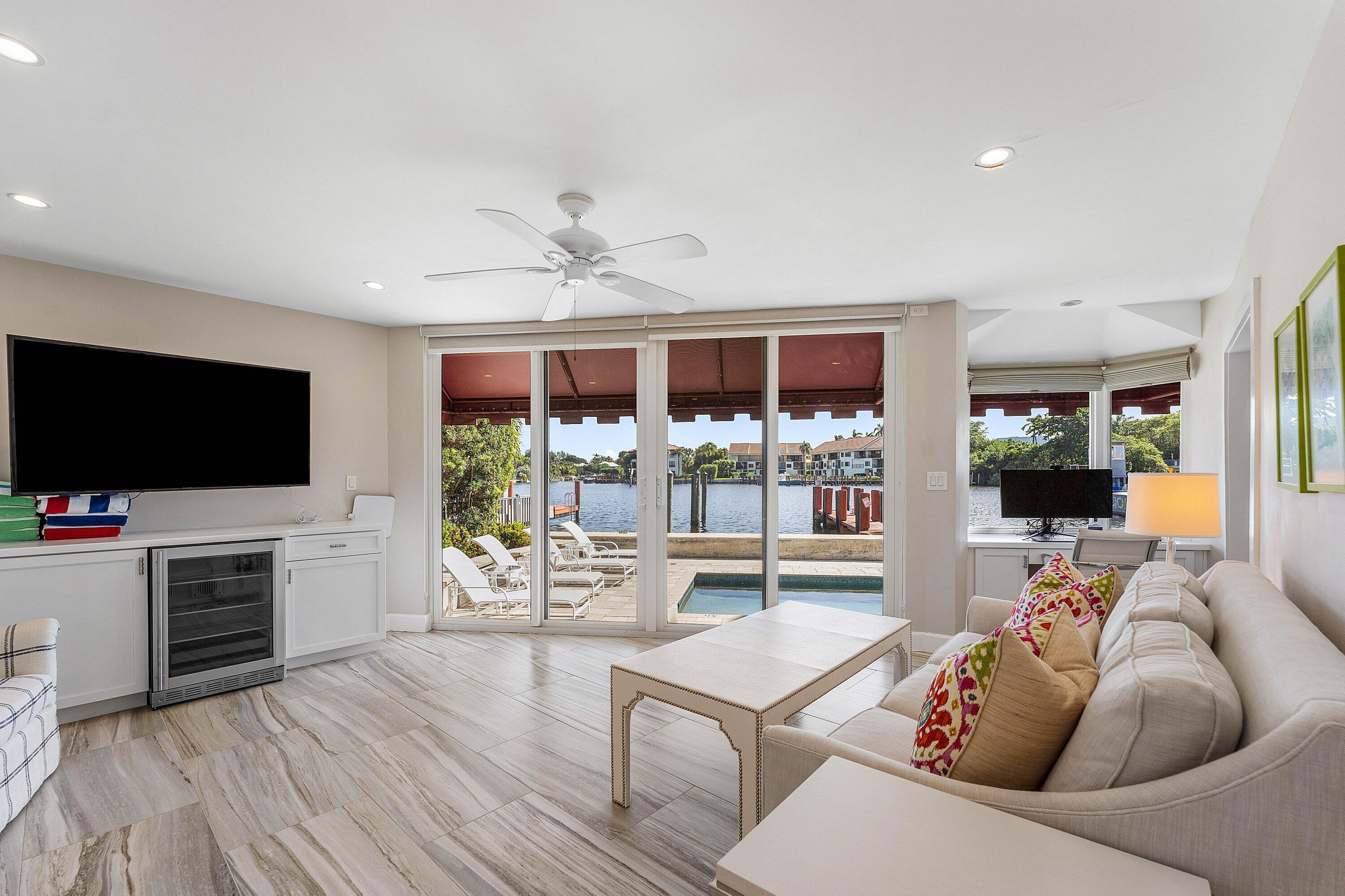 811 Palm Trail Delray Beach, FL 33483 - Photo 24 of 57 a living room with furniture and a flat screen tv