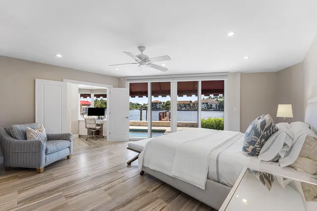 a bathroom with a bathtub shower sink vanity and toilet