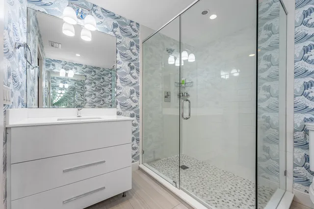 a view of a garden with potted plants and large trees