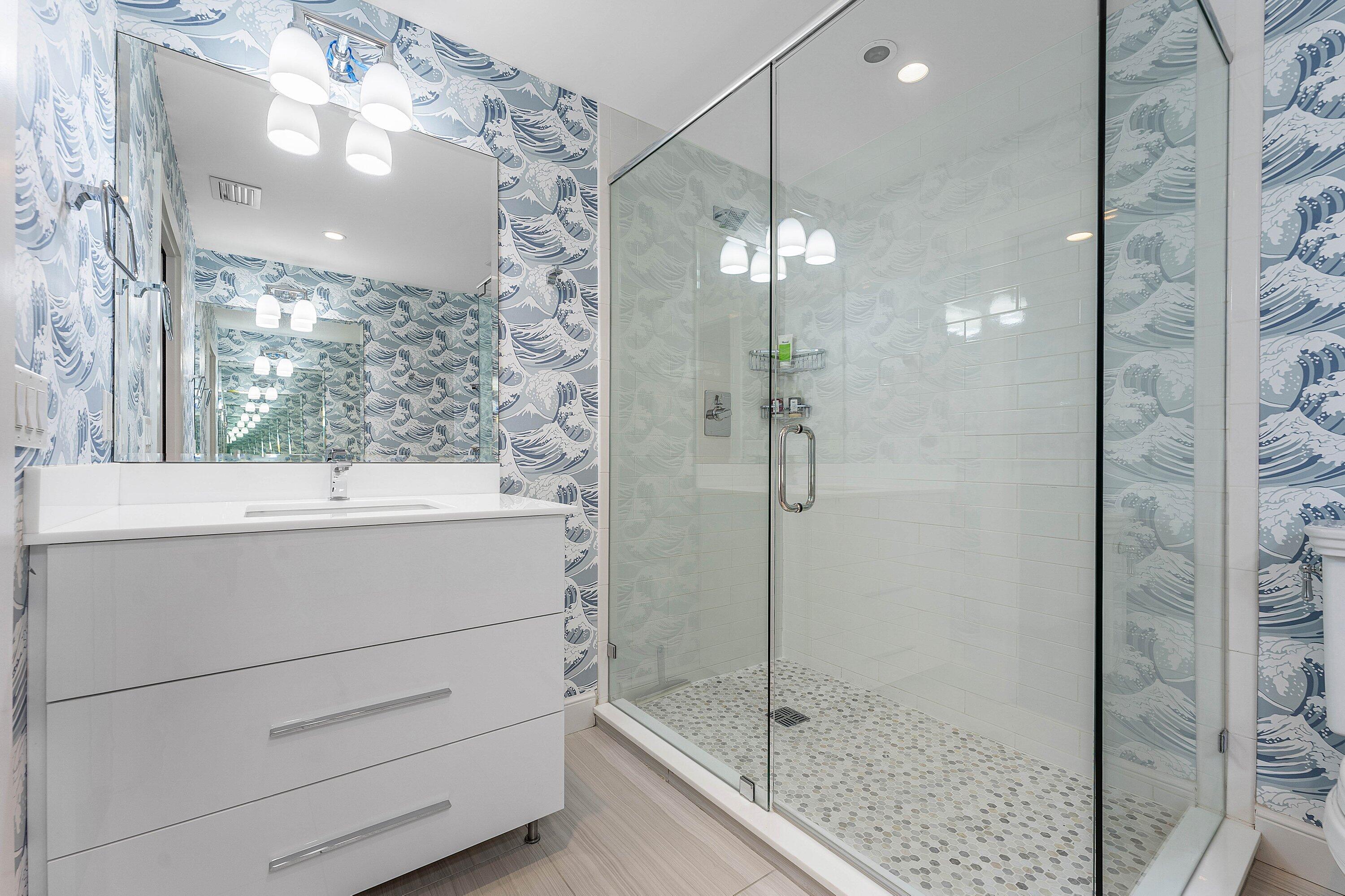 811 Palm Trail Delray Beach, FL 33483 - Photo 30 of 57 a bathroom with a shower vanity and a sink