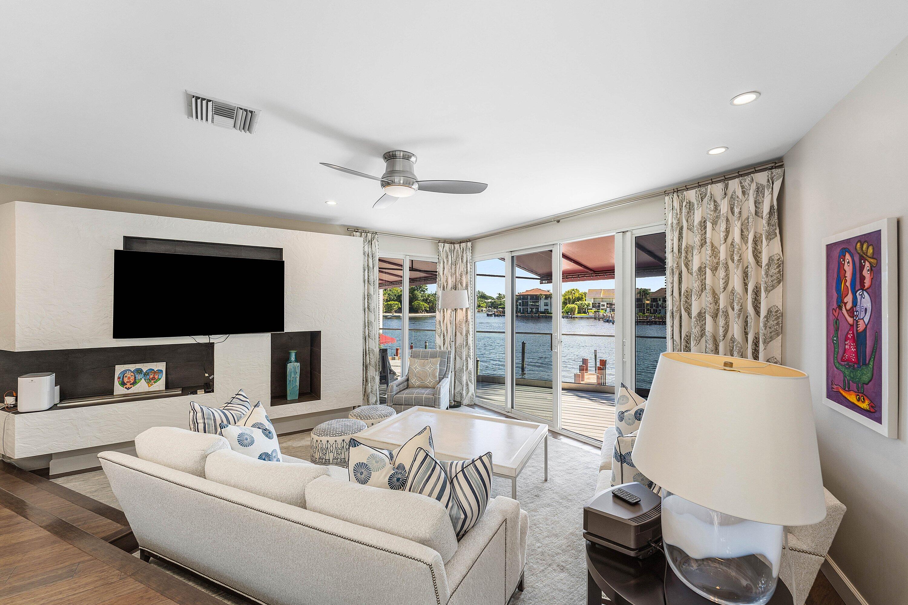 811 Palm Trail Delray Beach, FL 33483 - Photo 3 of 57 a living room with furniture and a flat screen tv