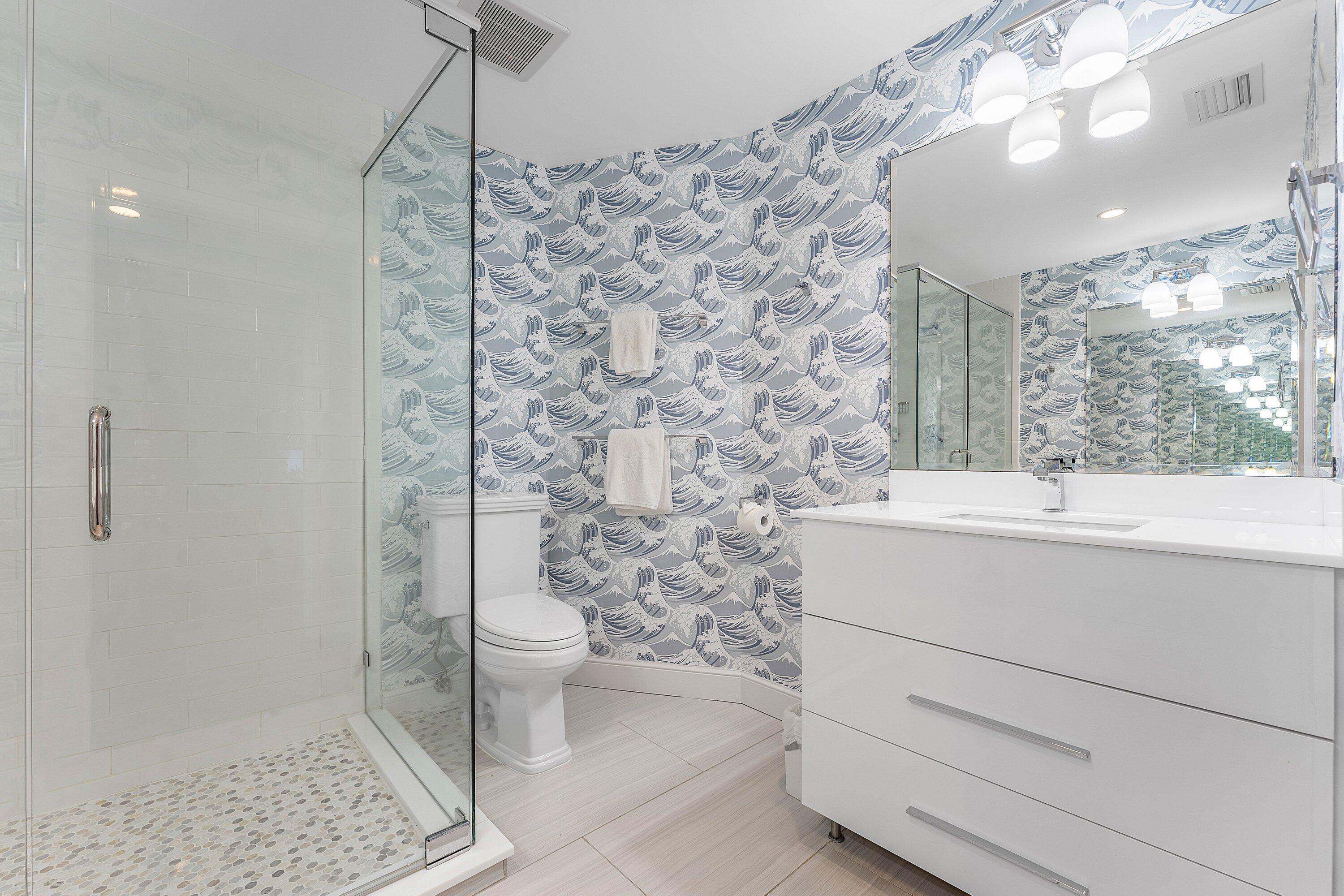 811 Palm Trail Delray Beach, FL 33483 - Photo 31 of 57 a bathroom with a sink a toilet a window and vanity