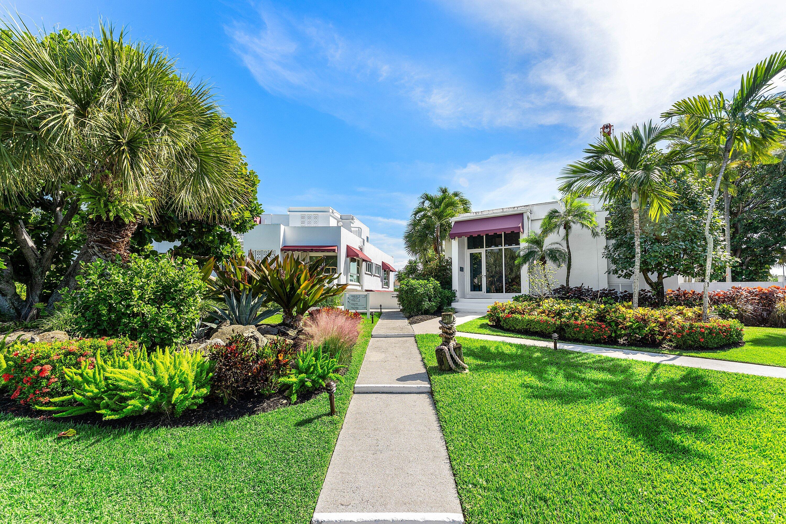 811 Palm Trail Delray Beach, FL 33483 - Photo 33 of 57 a view of a garden with potted plants and large trees