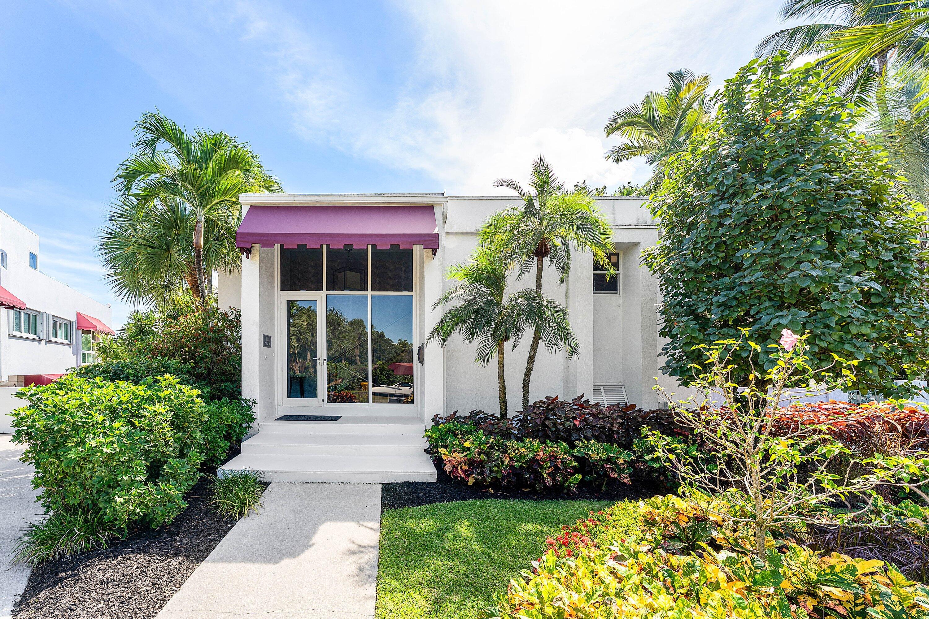 811 Palm Trail Delray Beach, FL 33483 - Photo 34 of 57 a front view of a house with a yard