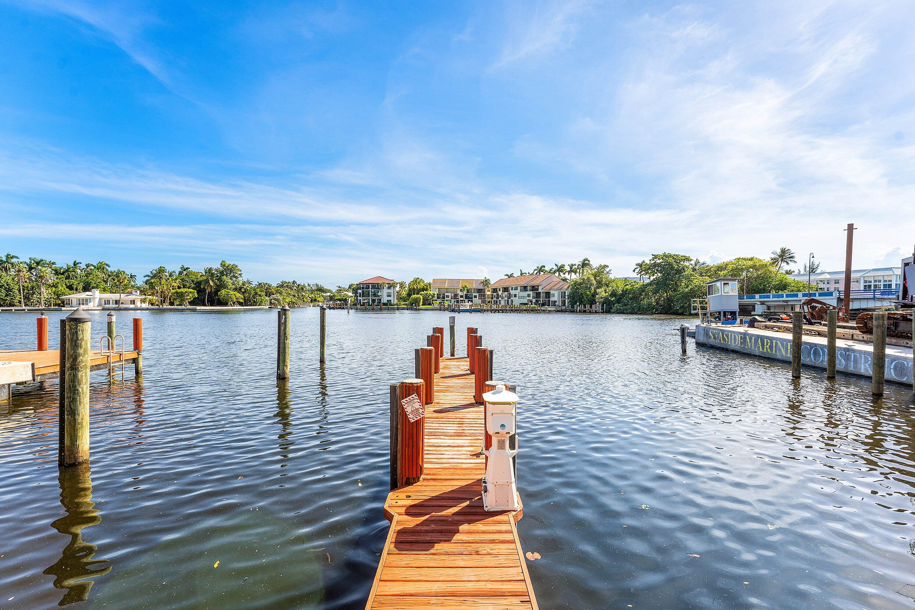 811 Palm Trail Delray Beach, FL 33483 - Photo 39 of 57 a view of a lake with boats and trees in the background