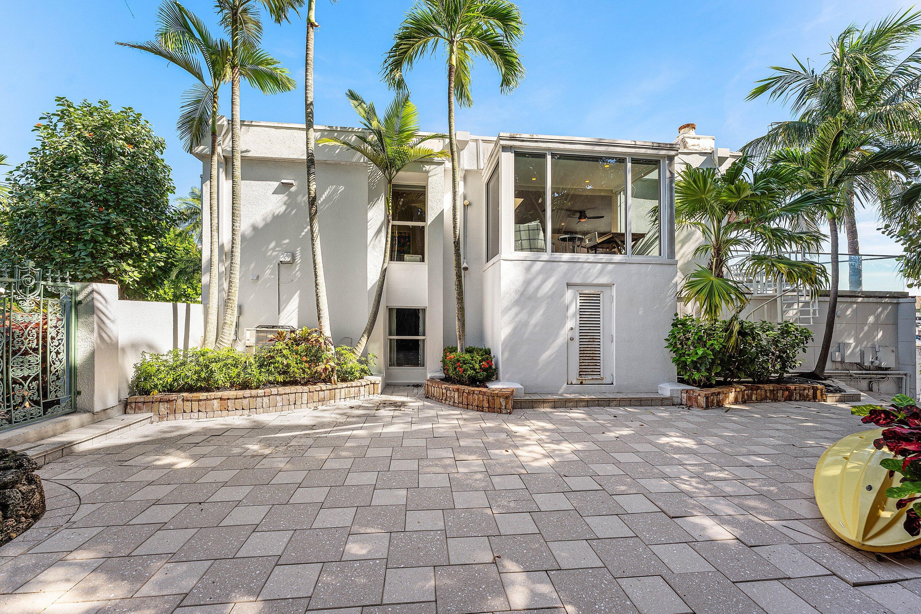 811 Palm Trail Delray Beach, FL 33483 - Photo 42 of 57 a front view of a house with a patio