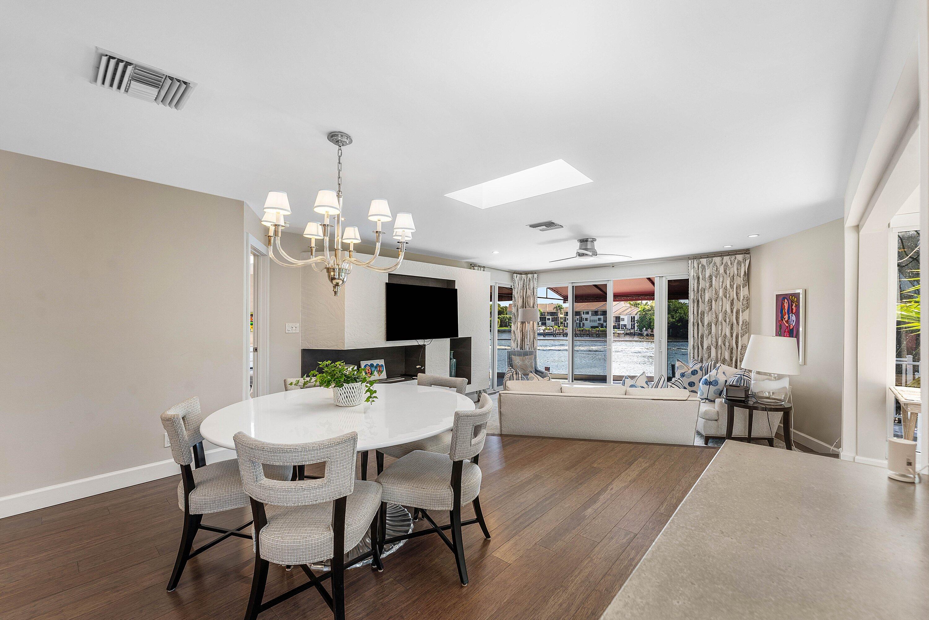 811 Palm Trail Delray Beach, FL 33483 - Photo 5 of 57 a view of a dining room with furniture window and wooden floor