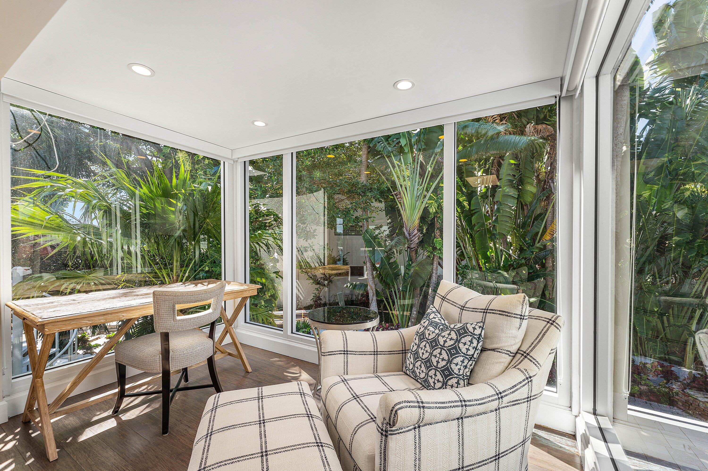 811 Palm Trail Delray Beach, FL 33483 - Photo 10 of 57 a living room with furniture and a large window