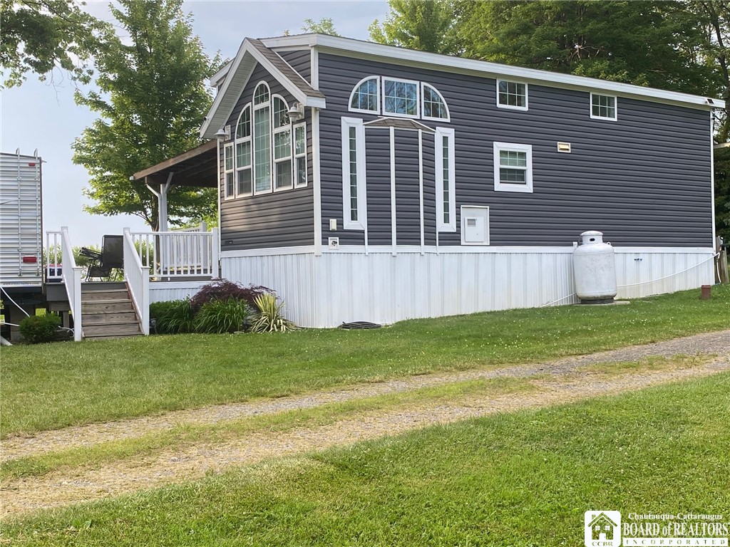 8499 Klinger Road Portland, NY 14769 - Photo 1 of 1 DRIVE SIDE OF TINY HOME