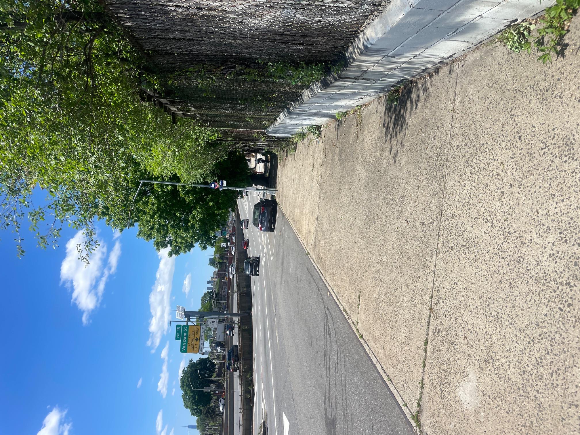 39th Street Queens, NY 11104 - Photo 2 of 5 View of asphalt road featuring street lighting
