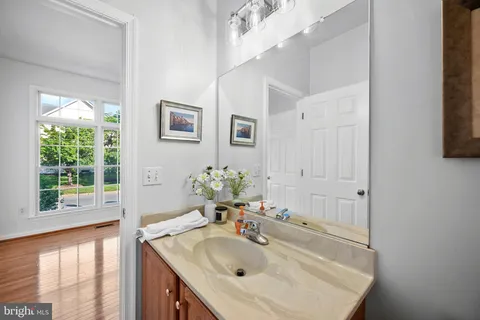 a bathroom with a sink and a window