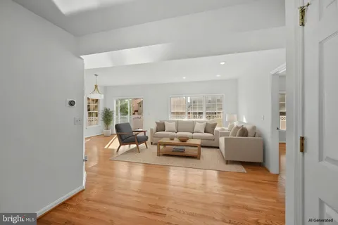 a living room with fireplace furniture and a wooden floor