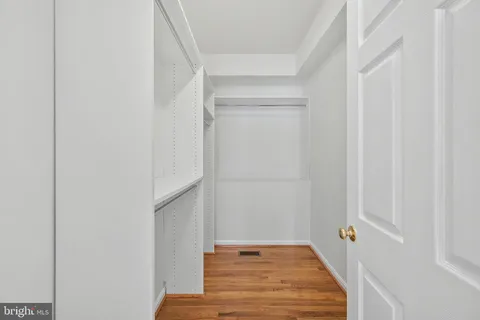 a view of bathroom with wooden floor