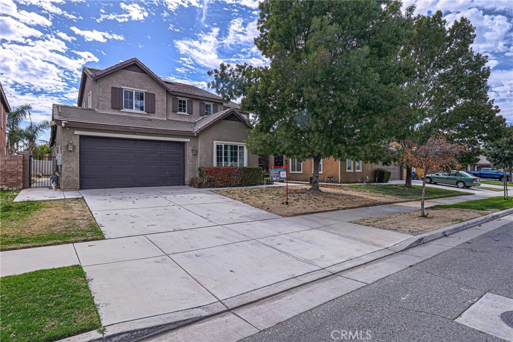 9819 Riata Lane Bakersfield, CA 93306 - Photo 1 of 1 a front view of a house with a yard