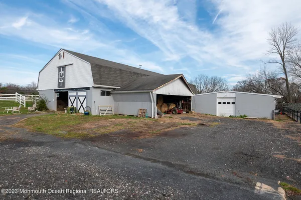 a view of a house with a yard and garage