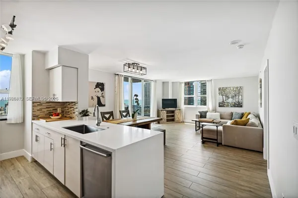 a view of living room with furniture and a large window