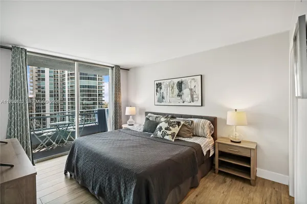 a bedroom with a large bed and a window