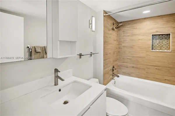 a bathroom with a sink and a shower