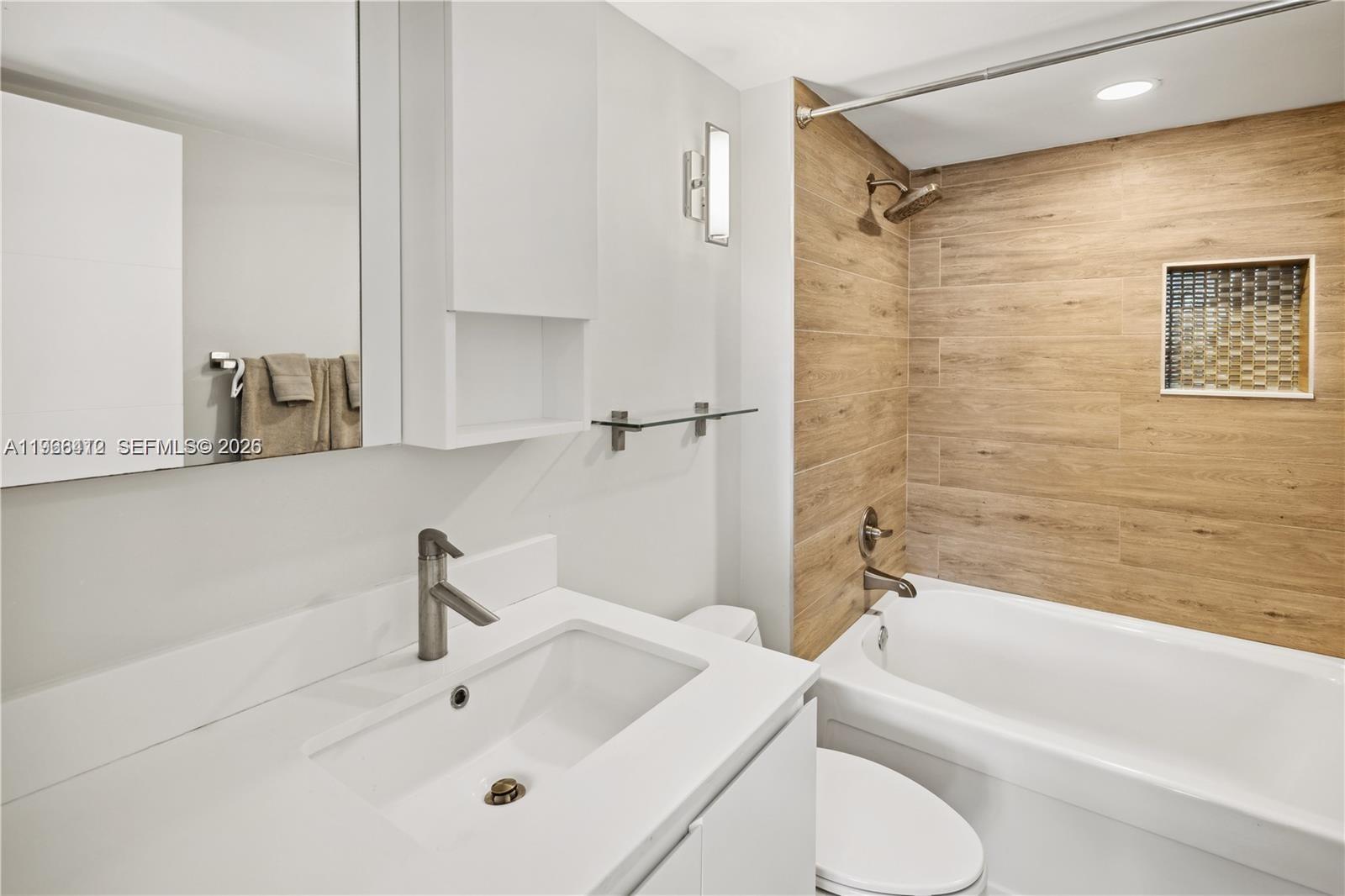 90 Alton Road, Unit 1901 Miami Beach, FL 33139 - Photo 10 of 17 a bathroom with a sink and a shower