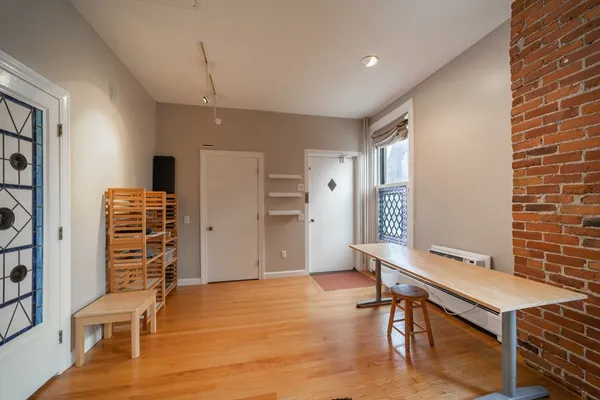 a room with furniture and wooden floor