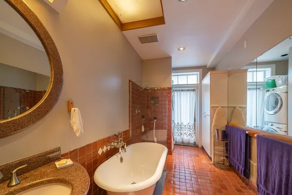 a bathroom with a sink a toilet and bathtub
