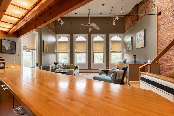 a lobby with furniture and floor to ceiling window