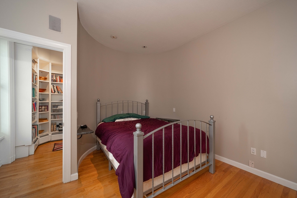 135 Main Street Northampton, MA 01060 - Photo 10 of 28 a view of bedroom with furniture and wooden floor