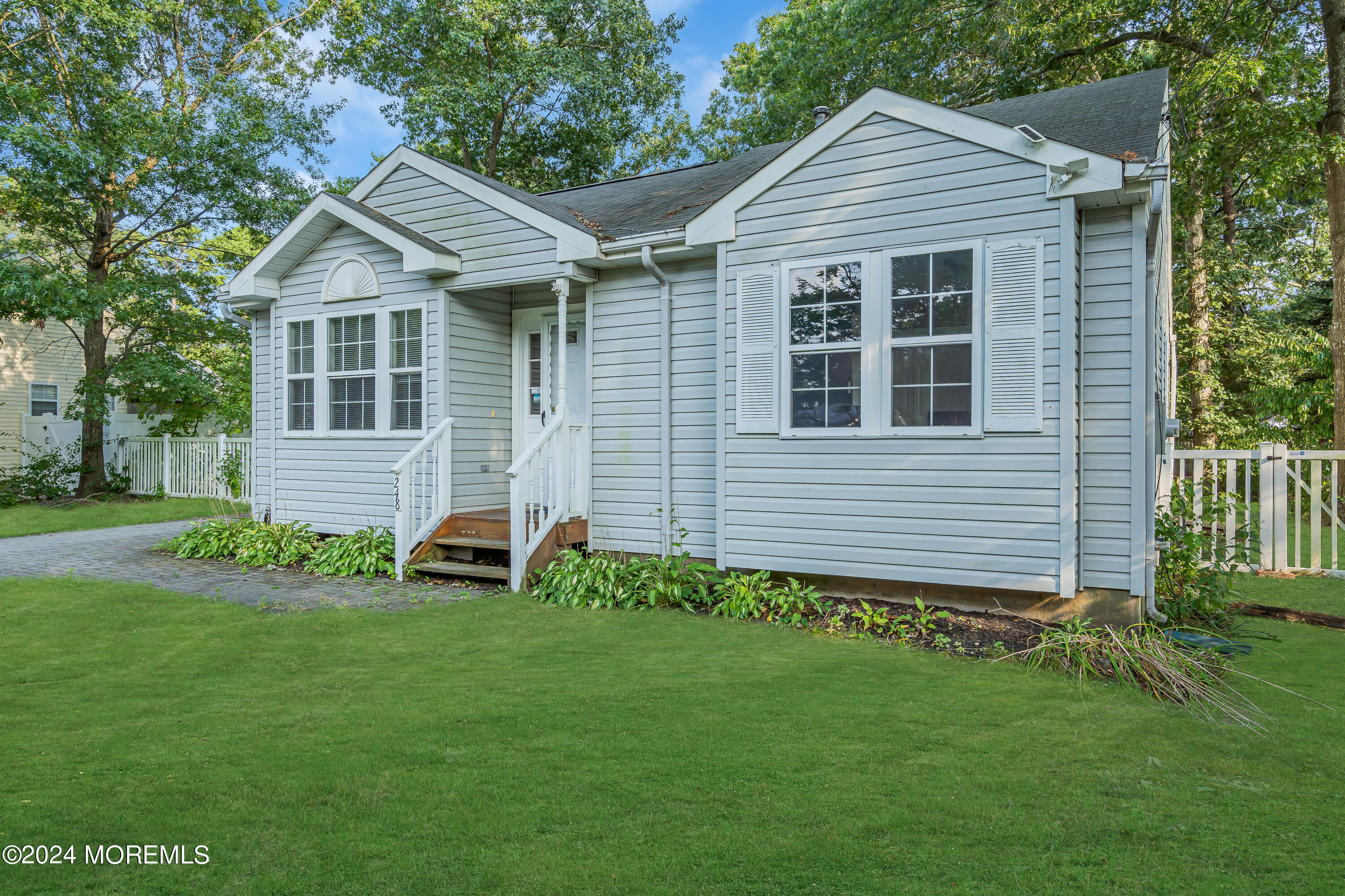 248 Stormy Road Manahawkin, NJ 08050 - Photo 28 of 28 a front view of a house with a yard