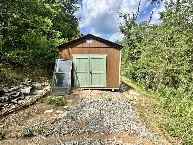a view of a house with a small yard