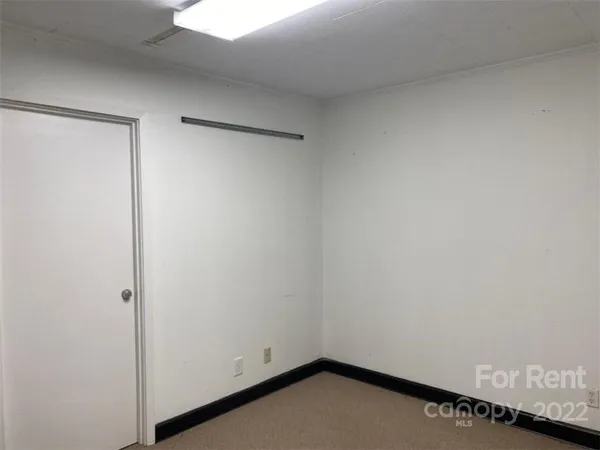 a view of small space with wooden floor