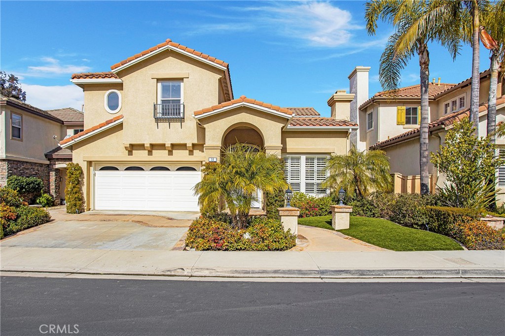 59 Rolling Ridge Rancho Santa Margarita, CA 92688 - Photo 1 of 1 a front view of a house with a yard and garage