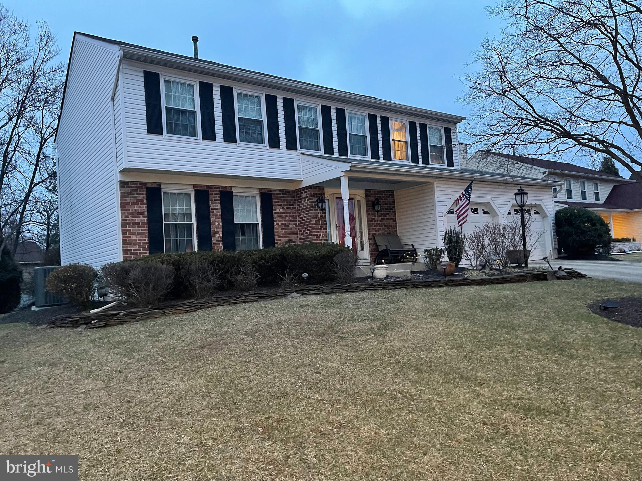 10918 Spyglass Hill Bowie, MD 20721 - Photo 2 of 9 a front view of a house with a yard