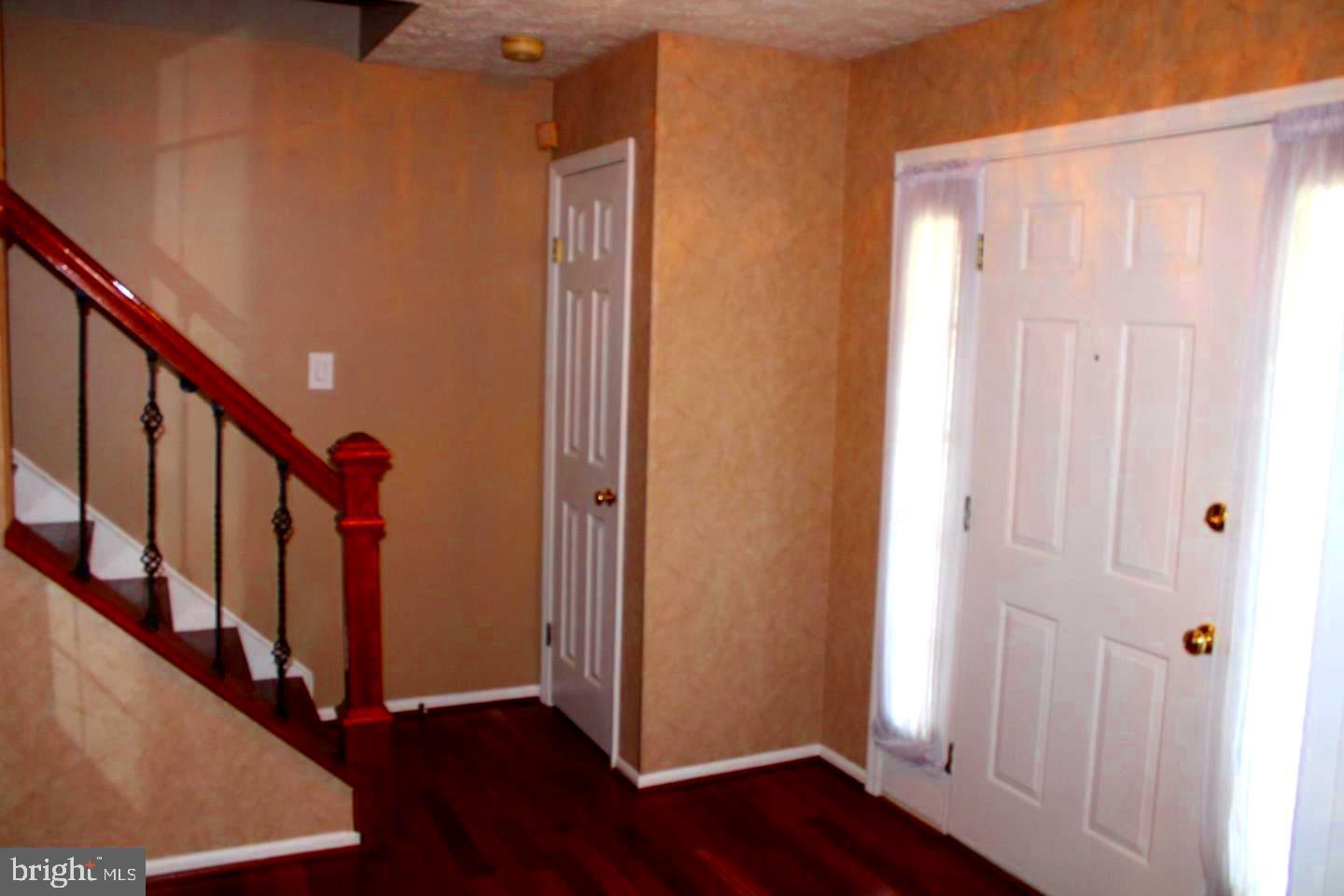10918 Spyglass Hill Bowie, MD 20721 - Photo 3 of 9 a view of an entryway with wooden floor