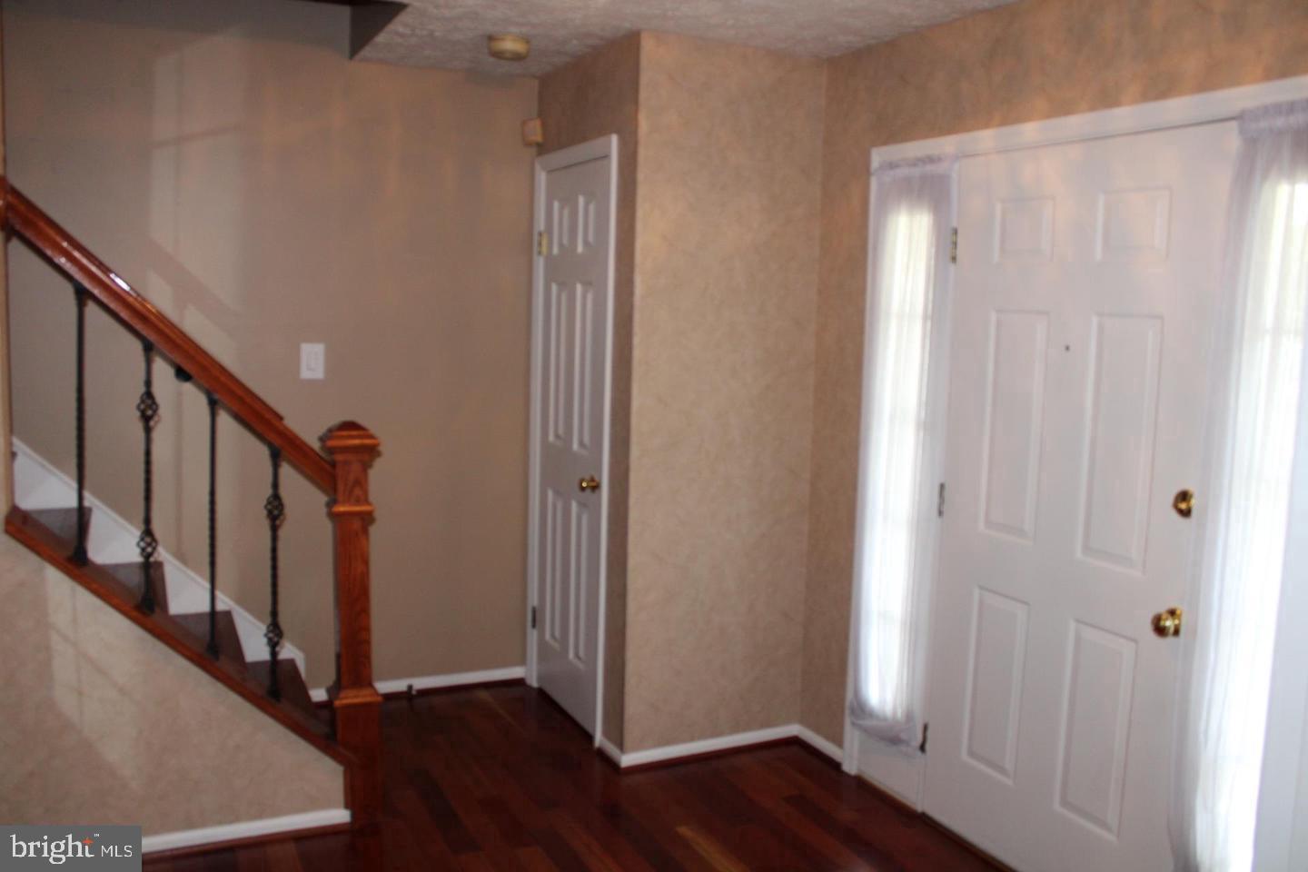 10918 Spyglass Hill Bowie, MD 20721 - Photo 4 of 9 a view of an entryway with wooden floor