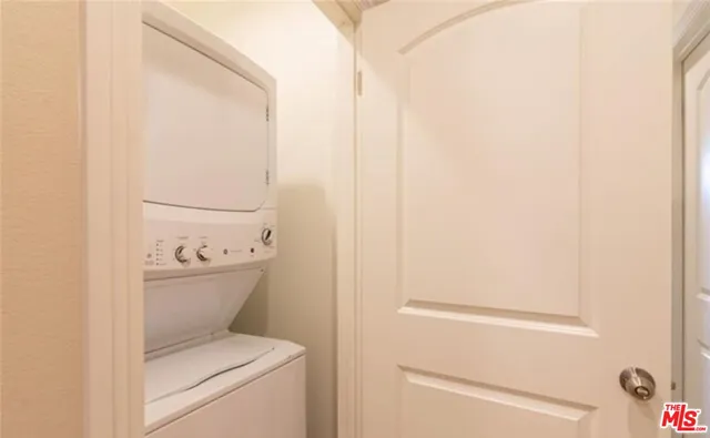 a view of bathroom with washer and dryer