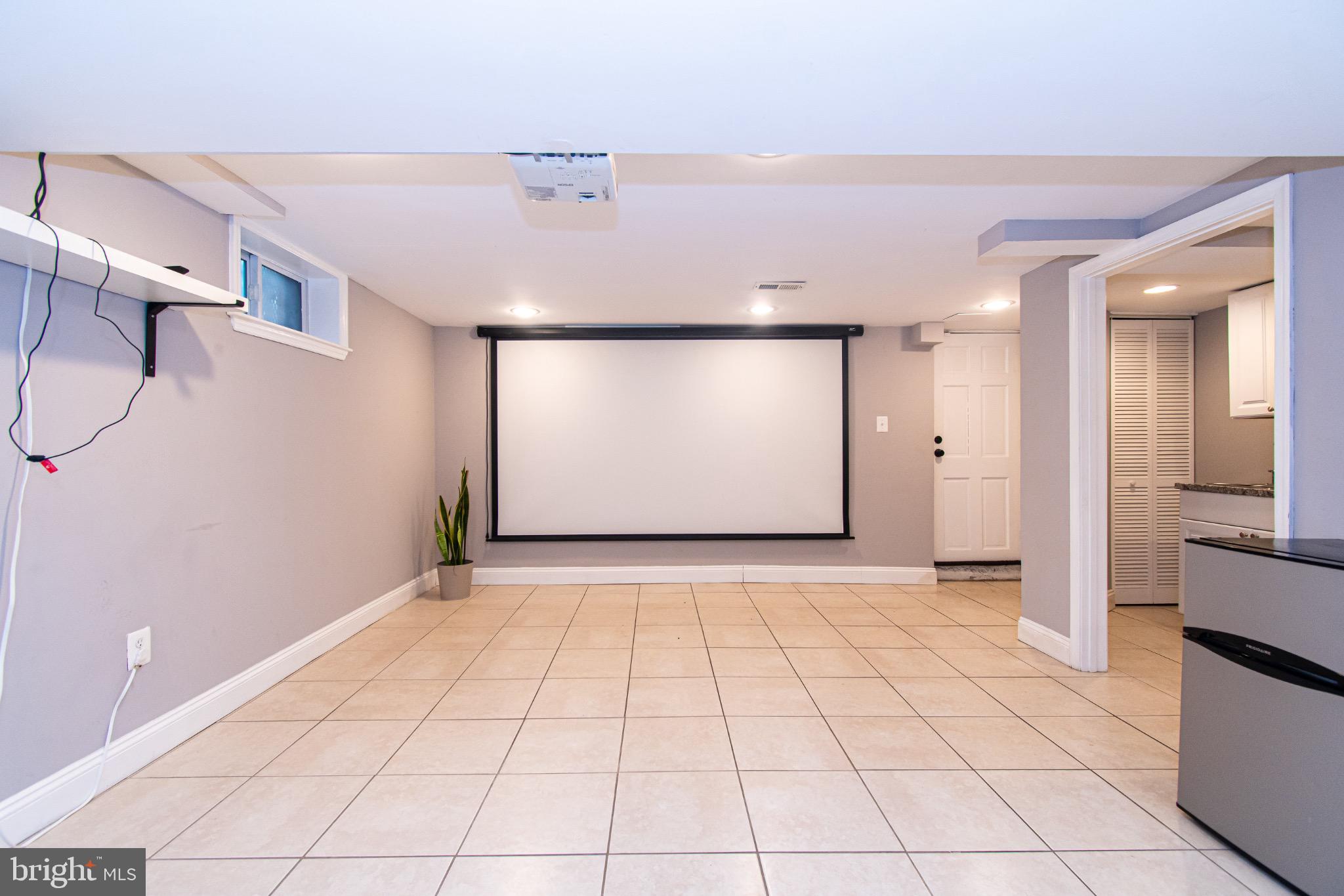 2039 Hillenwood Road Baltimore, MD 21239 - Photo 1 of 15 Basement studio space with Projector screen incl.