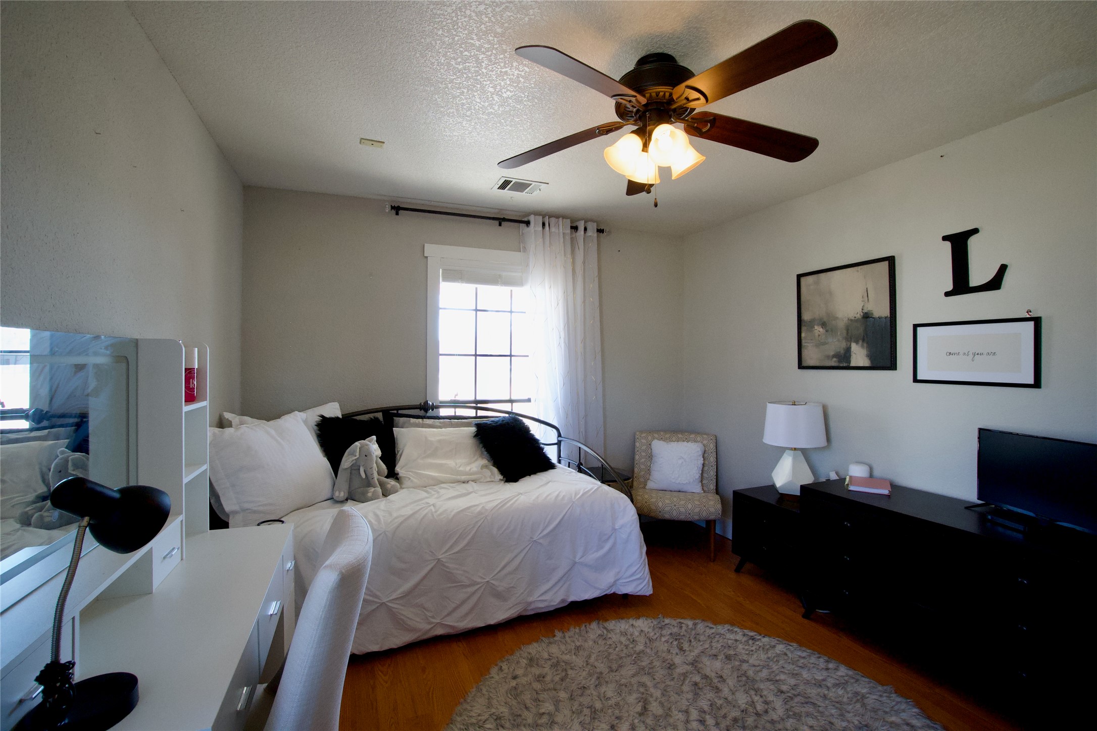 2352 Borchert Loop Lockhart, TX 78644 - Photo 17 of 39 a bedroom with a bed and a window