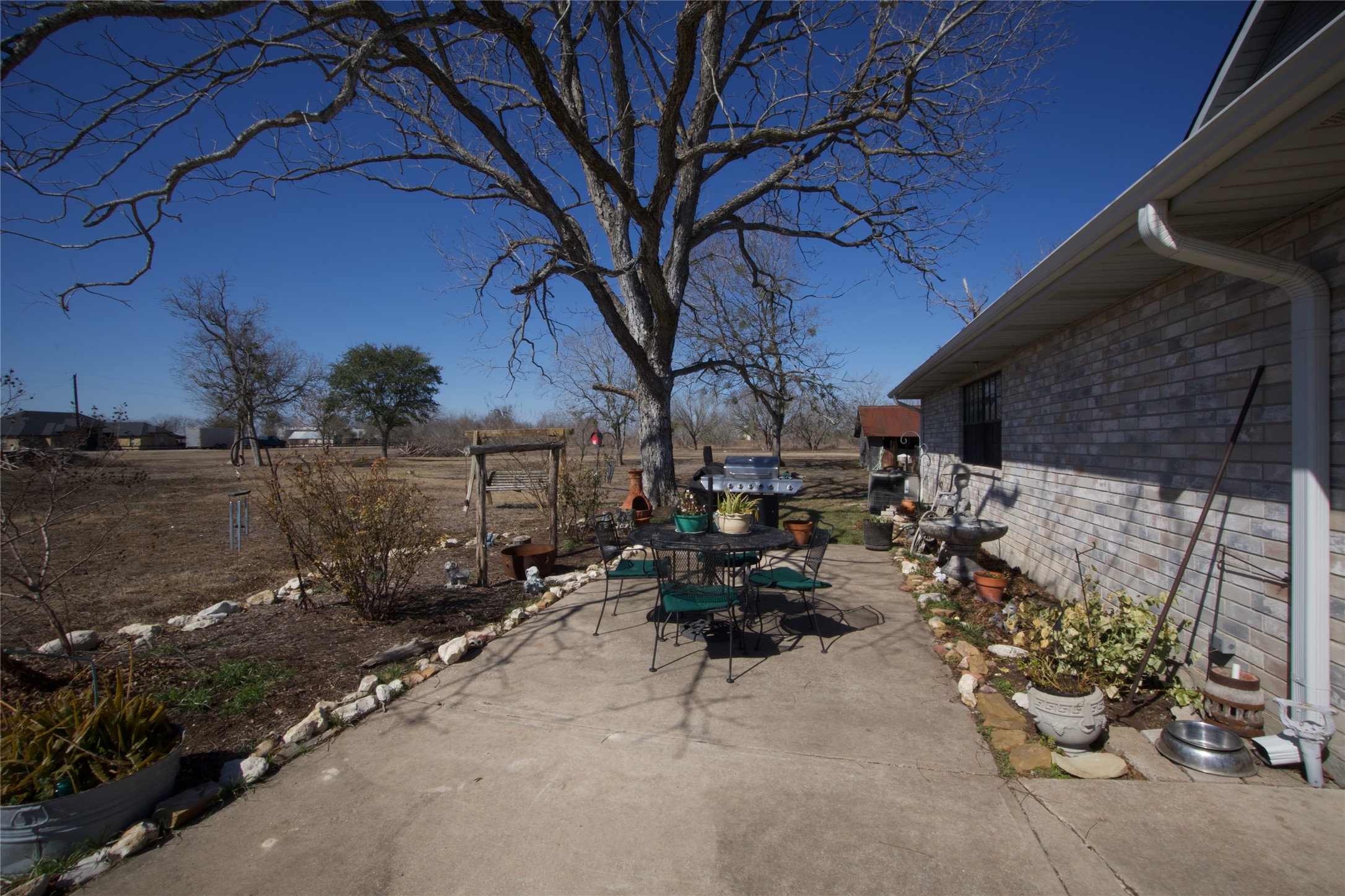 2352 Borchert Loop Lockhart, TX 78644 - Photo 28 of 39 a view of patio with chairs and potted plants