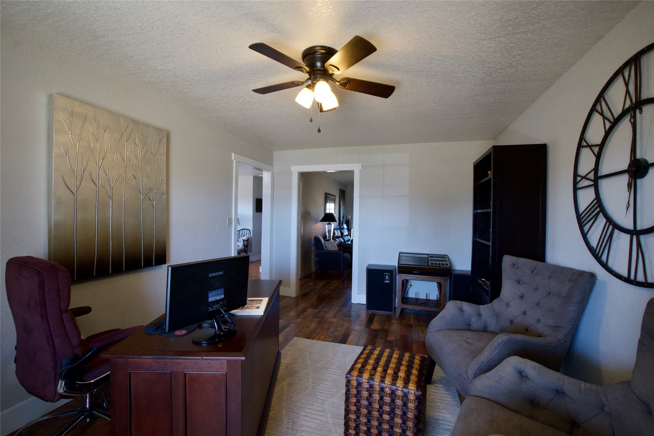 2352 Borchert Loop Lockhart, TX 78644 - Photo 7 of 39 a work room with furniture wooden floor and a ceiling fan