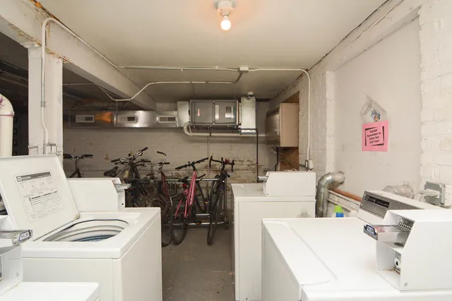 a room with furniture and white walls