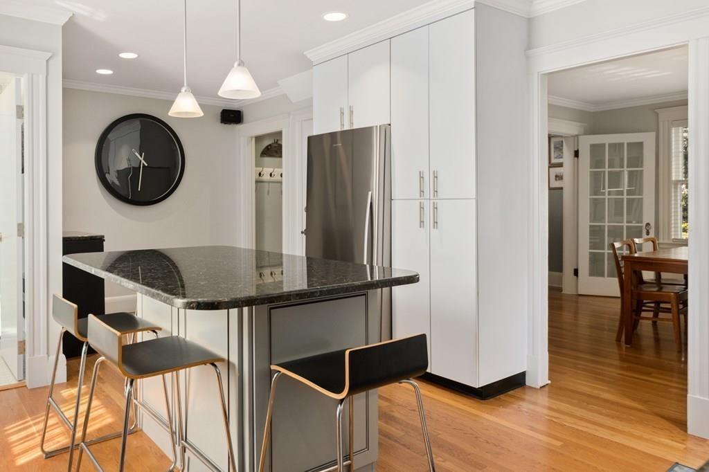 30 Homestead Road Marblehead, MA 01945 - Photo 18 of 35 a view of kitchen with stainless steel appliances granite countertop a stove a refrigerator a dining table and chairs with wooden floor